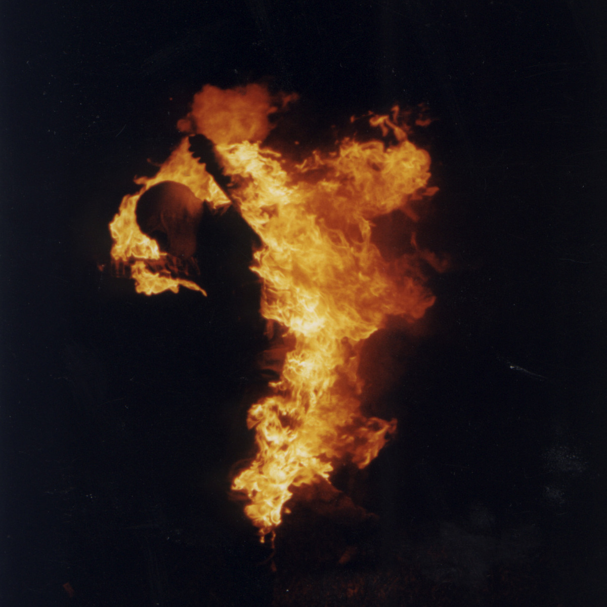 JD Roberto performing a full body fire burn stunt