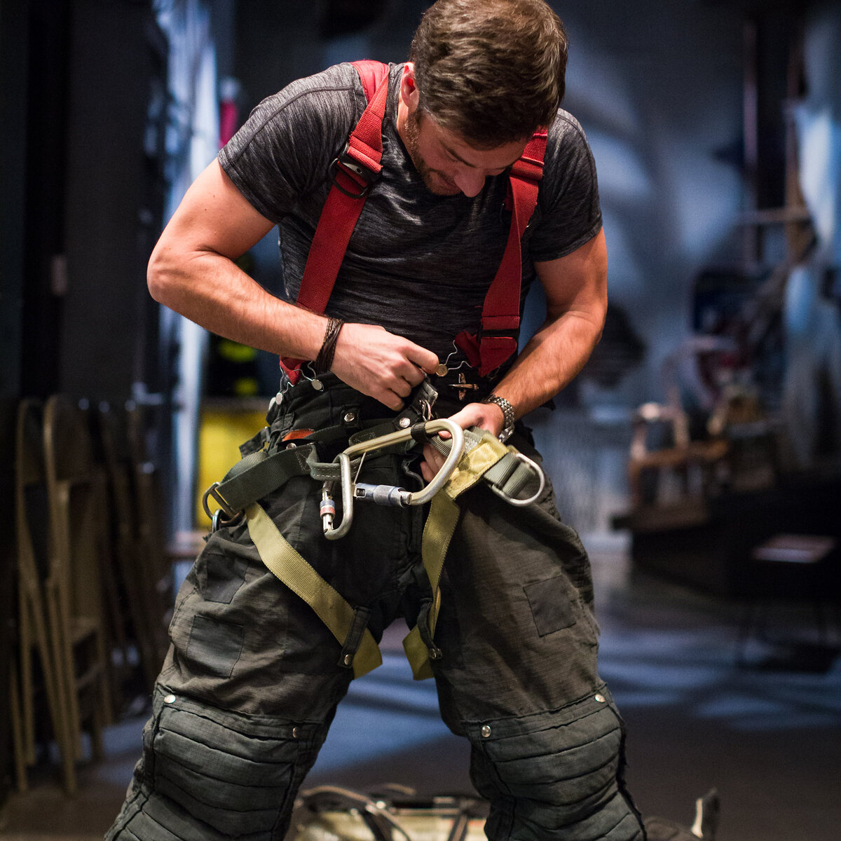 JD Roberto gearing up in a stunt harness